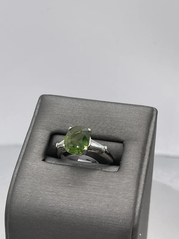 Baguette cut engagement ring for women-Platinum Oval Green Sapphire And Diamond Baguette Ring